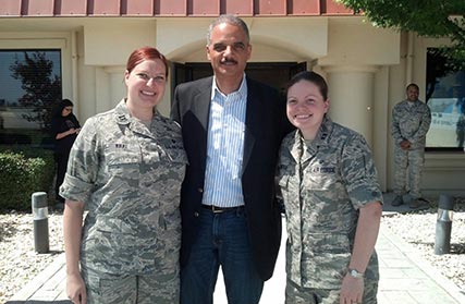 Photo of Stephanie Kral, Abby Hunter, and Attorney General Eric Holder