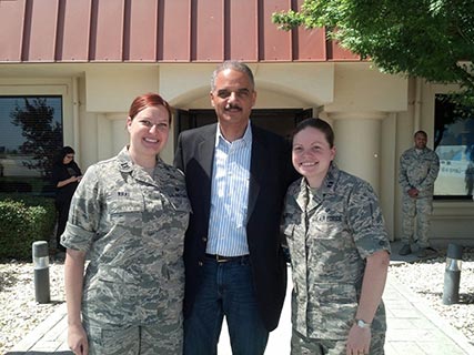 Photo of Stephanie Kral, Abby Hunter, and Attorney General Eric Holder